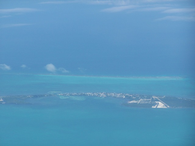 Aerial view of Caye Caulker with Belize Barrier Reef in the distance